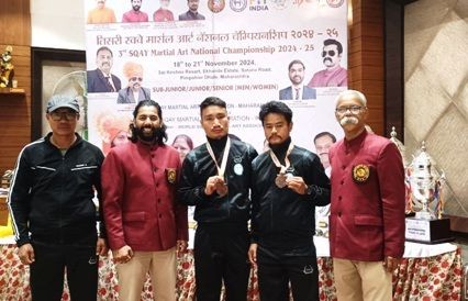 K Pushen and Khuming from Nagaland with officials pose for lends after winning bronze medals at the 3rd SQAY Martial Art National Championship 2024-2025, held in Maharashtra from November 18 to 20.